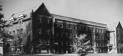 After starting out in a dormitory basement, the School of Business Administration moved into Storrs Hall (pictured) in 1949.